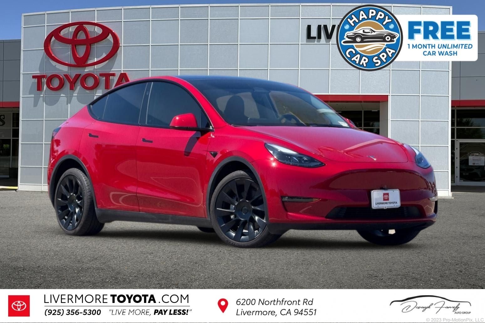 2023 Tesla Model Y Long Range in Red Multi-Coat — front three-quarter view